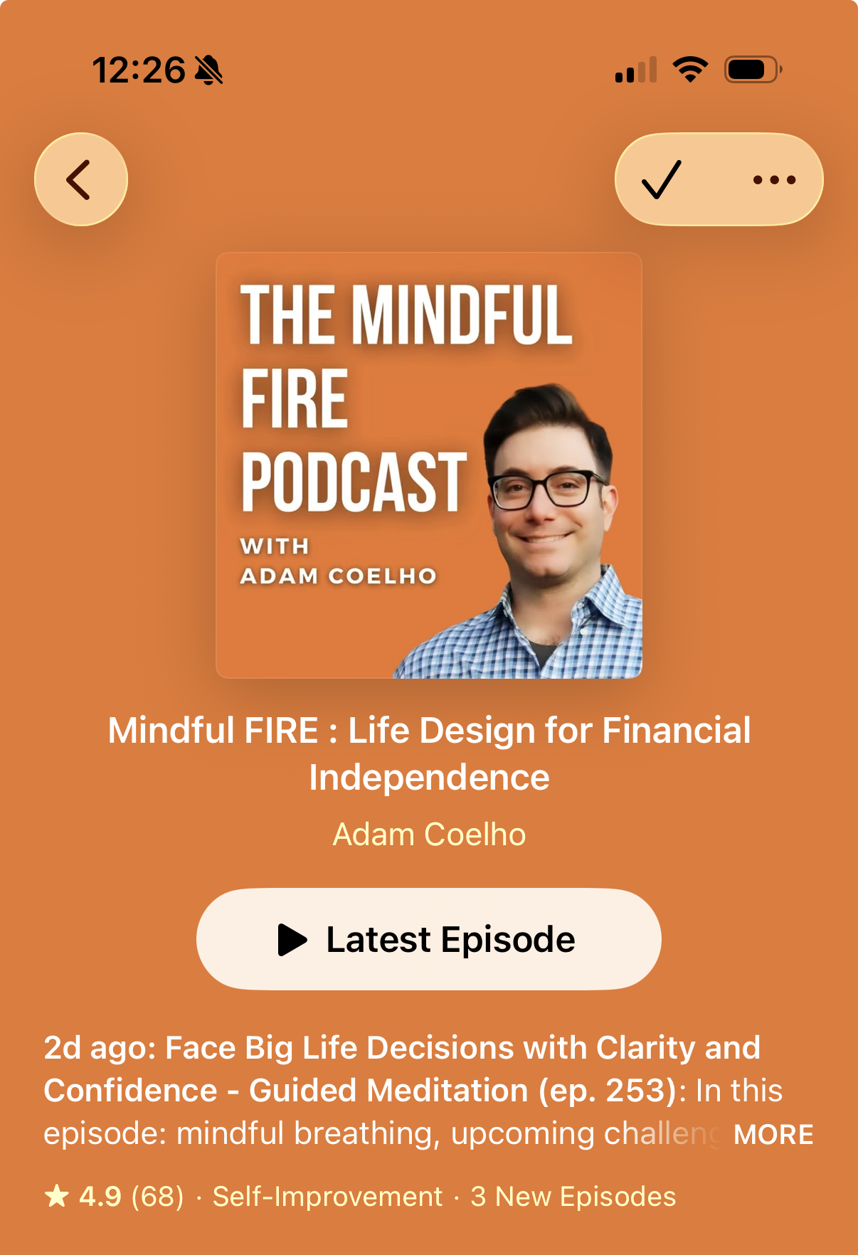 Mindful FIRE show page in the iPhone Apple Podcasts app, with its orange cover and Adam Coelho’s name